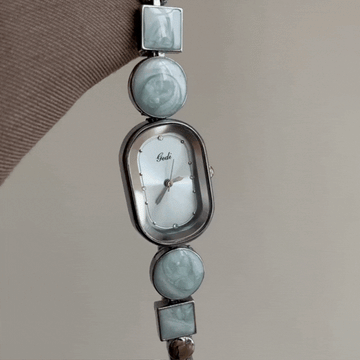 Narukvica s geometrijskim vezama - ovalni srebrni brojčanik za žene