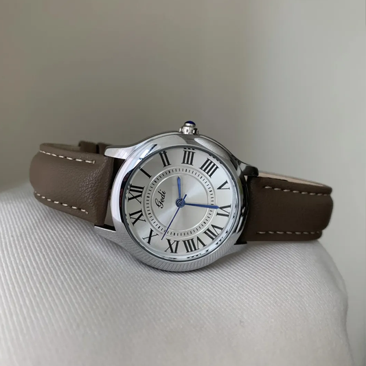 Montre à quartz pour femme en cuir gris éléphant avec cadran argenté à chiffres romains