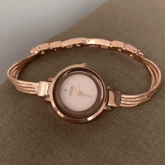 Montre élégante en or rose : montre à quartz ronde avec chaîne à pompons