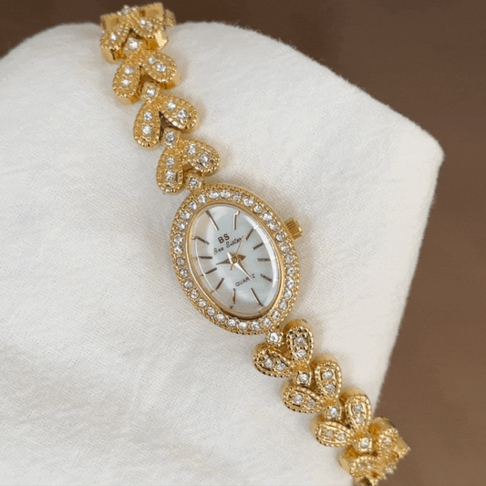 Aurélia Grain – Elegant Gold Wheat-Link Women’s Quartz Watch with Diamond-Accented Oval Dial Bracelet