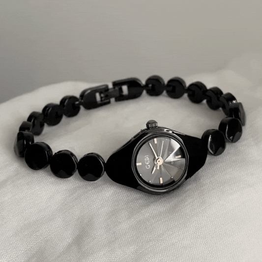 Montre à quartz minimaliste noire et élégante avec bracelet fin