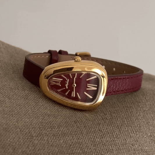 Crimson Elegance Timepiece: Gold and Burgundy Serpenti Watch