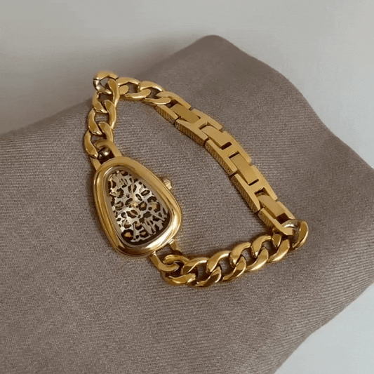Serpenti Luxe – Gold Bracelet Watch with Leopard Face