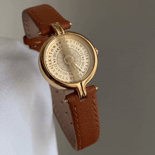 Montre à quartz classique vintage marron et or de Roman Holiday