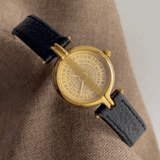 Midnight Gold Leather Quartz Timepiece: Black and Gold Watch
