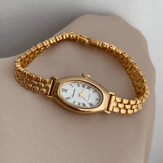 Elliptical Roman Timepiece: Luxe Vintage French Gold Watch