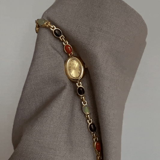 Elegance in Motion – Gold Oval Watch with Jade Bracelet
