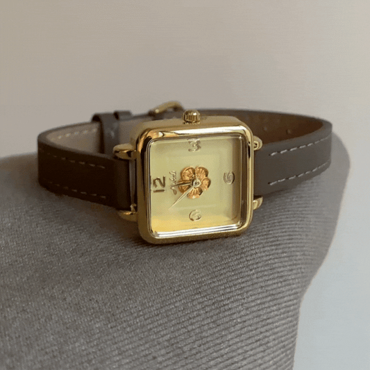 Charme élégant : montre à quartz en cuir gris éléphant et camélia carré doré