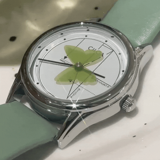 Montre à quartz pour femme avec bracelet vert – Cadran rond blanc et aiguilles papillon, élégante et unique