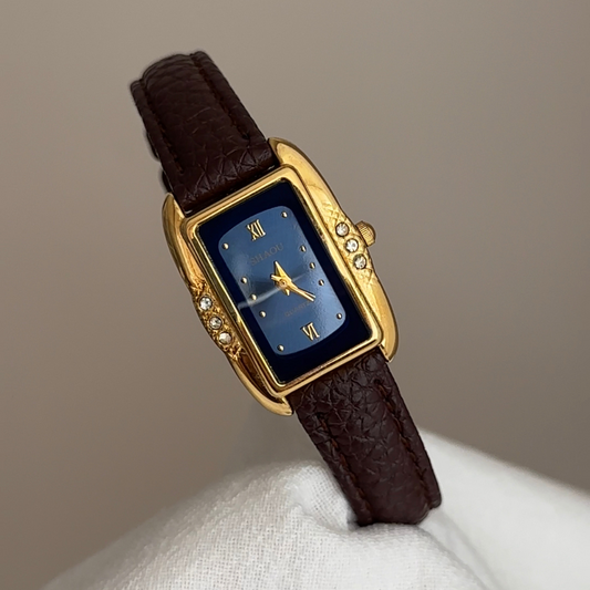 Black Leather Strap Women’s Quartz Watch – Blue Rectangle Dial with Gold Diamond-Accented Case
