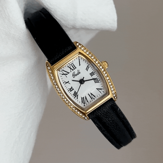 Luxury Vintage Women’s Quartz Watch – Black Leather Strap, Roman Numerals, Gold Diamond Barrel Case with White Dial