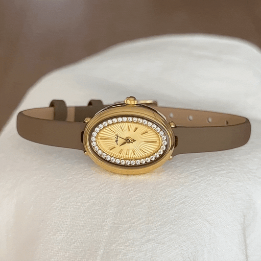 Elegant Women’s Quartz Watch – Elephant Grey Thin Leather Strap with Diamond-Accented Oval Gold Small Dial