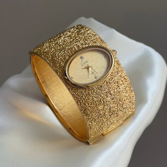 Vintage Textured Gold Wide Cuff Watch with Oval Wave-Pattern Dial