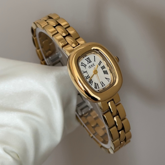Classic Grace Elegant: White Oval Dial Watch with Gold Bezel & Stainless Steel Bracelet