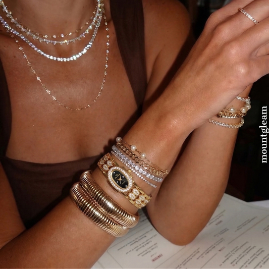 Elegant Gold Bangle Watch – Black Mother of Pearl Oval Dial for Women