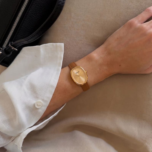 Amber Gold Timepiece: Oval Dial Leather Quartz Watch