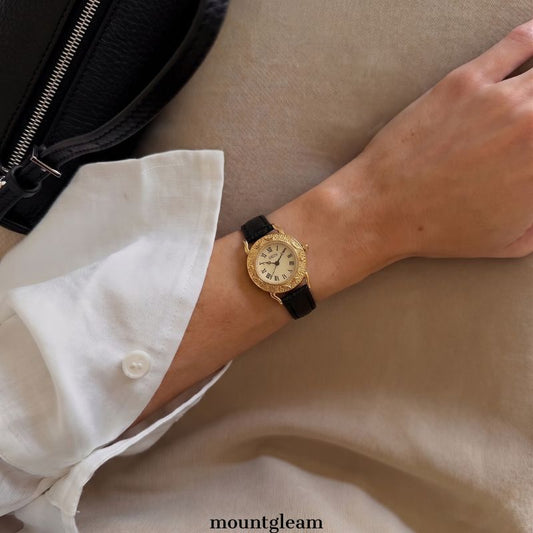 Regal Embossed Timepiece: Black Strap Gold Case Watch