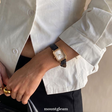 Noir Elegance – Black Leather Strap Women’s Quartz Watch with Gold Rectangular Case and Pearl Crystal Bezel
