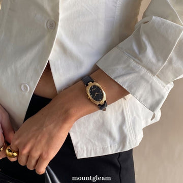 Oval Elegance: Black Oval Dial Watch with Gold Oval Bezel & Black Genuine Leather Strap