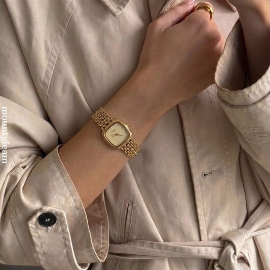 Manifesting Monochrome Luxury: A Gold Rectangle Dial with Matching Full Gold-Tone Bracelet