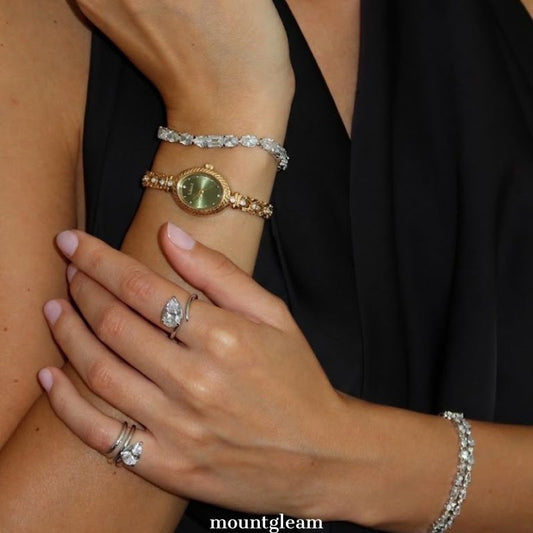 Luxe Shine: Green Oval Dial Watch with Gold Chain Bracelet