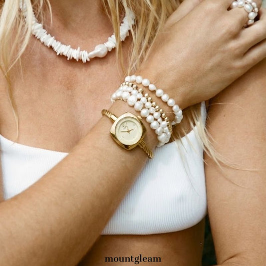 Golden Loop – Runde Quarzuhr für Damen im Armreif-Stil