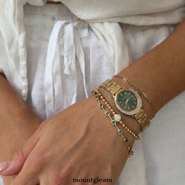 Diamond Sparkle: Green Oval Dial Watch with Gold Diamond Bezel & Gold Stainless Steel Bracelet