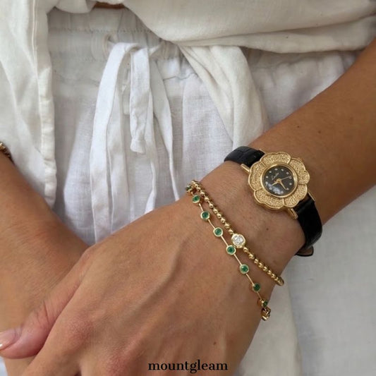 Sophisticated Floral Black Dial Watch with Gold Case & Leather Strap
