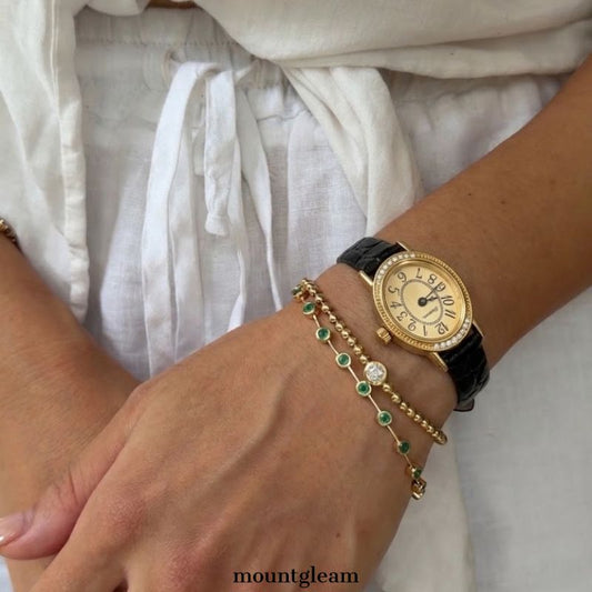 Elegant Fashion Black Leather Strap Women’s Quartz Watch with Oval Gold Diamond-Accented Dial