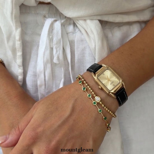 Modern Contrast: Gold Rectangular Dial Watch with Matching Bezel & Black Leather Strap