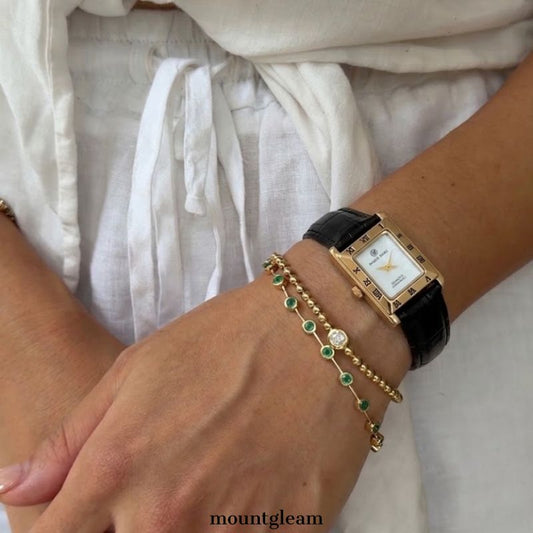 Contemporary Classic: White Rectangular Dial Watch with Gold-Tone Bezel & Black Leather Strap