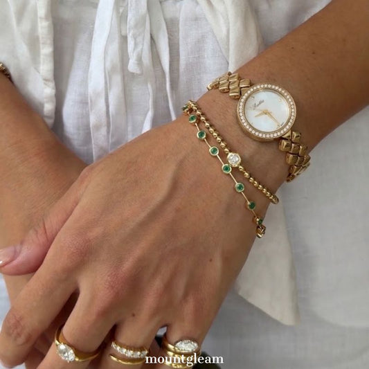 Diamond Sparkle: White Round Mother-of-Pearl Dial Watch with Gold Diamond Bezel & Gold Quilted Chain Bracelet