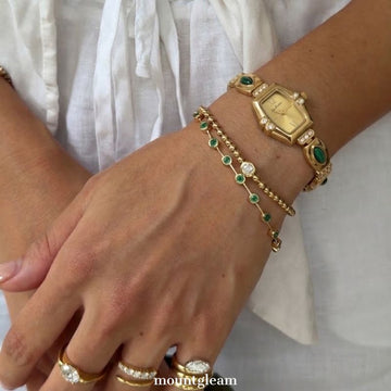 Elegant Gold-Tone Quartz Watch with Peacock Gemstone Accents and Alloy Strap
