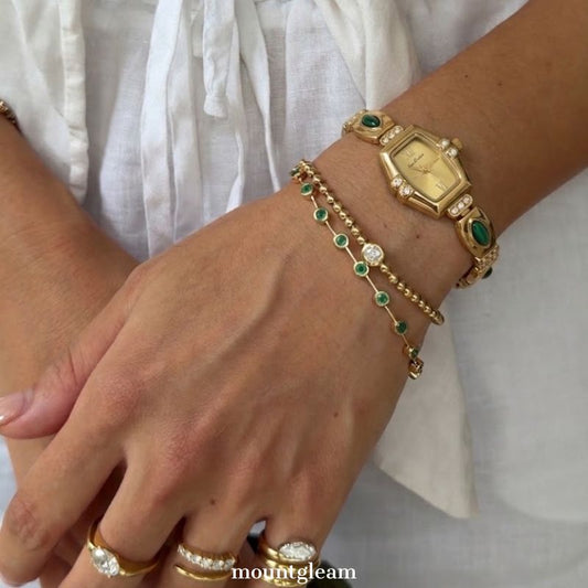 Elegant Gold-Tone Quartz Watch with Peacock Gemstone Accents and Alloy Strap