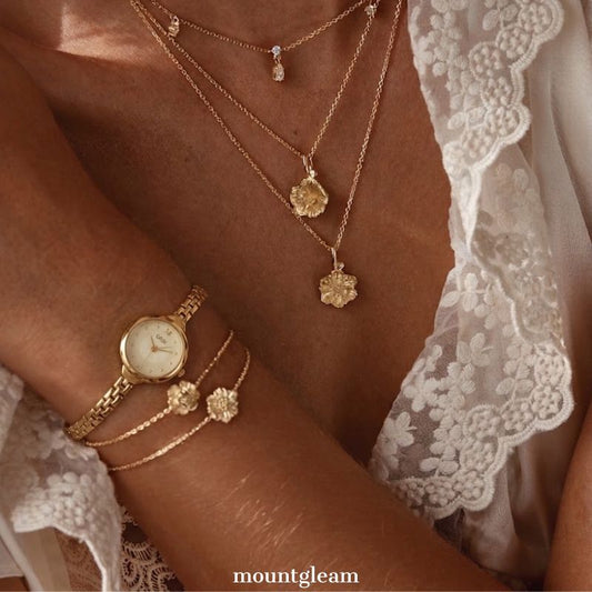 Luméa Vintage – Goldfarbene Damen-Quarzuhr mit schmalem Armband und rundem Retro-Zifferblatt