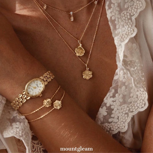 Warm Gold Elegant: White Oval Dial Watch with Gold Oval Bezel & Matching Bracelet