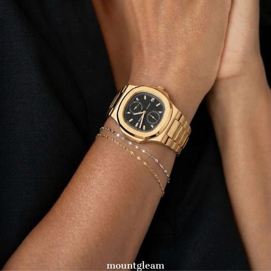 Sophisticated Edge: Black Round Dial Watch with Gold Oval Bezel & Stainless Steel Bracelet