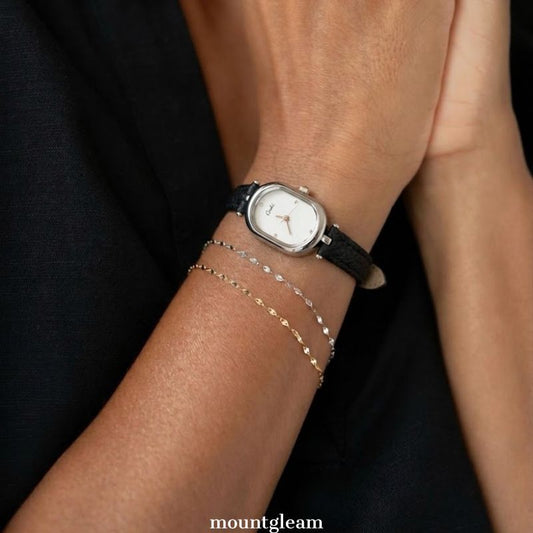 Modern Elegance: White Elongated Oval Dial Watch with Silver Bezel & Black Microfiber Leather Strap