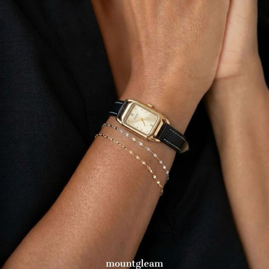 Modern Contrast: Gold Rectangular Dial Watch with Matching Bezel & Black Leather Strap