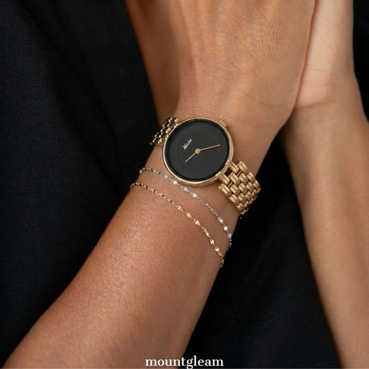 Luxe Contrast: Black Round Dial Watch with Gold Bezel & Gold Stainless Steel Bracelet