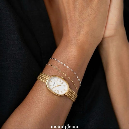 Warm Elegant: White Oval Dial Watch with Gold Wheat Pattern Stainless Steel Bracelet