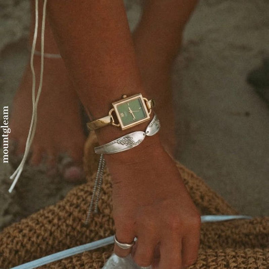 Cuff Chic: Green Square Dial Watch with Gold Cuff Bracelet