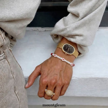 Chic Oval Black Dial Watch with Gold Case & Wheat-Pattern Bracelet
