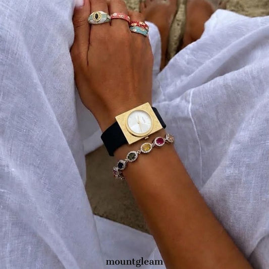 Geometric Fusion: White Round Dial Watch with Gold Rectangular Bezel & Black Silicone Strap