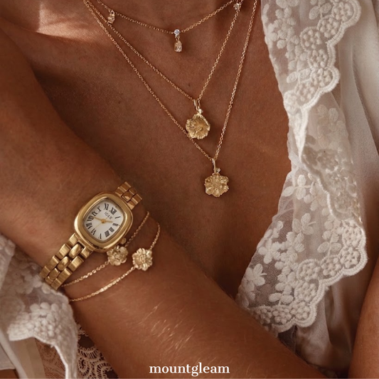 Classic Grace Elegant: White Oval Dial Watch with Gold Bezel & Stainless Steel Bracelet