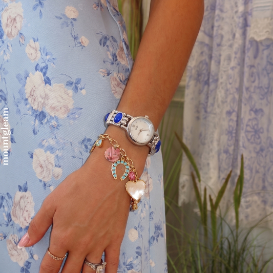 Chic Grace Elegant: White Mother-of-Pearl Round Dial Watch with Silver Bezel & Blue Gemstone Alloy Bracelet