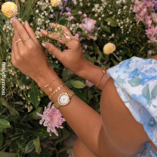 Versatile Elegant: White Oval Dial Watch with Gold Diamond Bezel & Gold Stainless Steel Bracelet