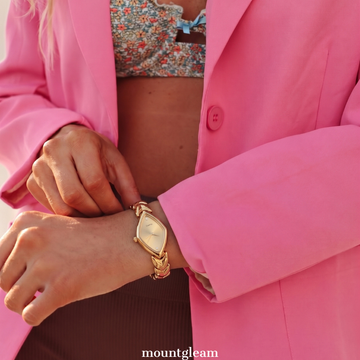 Modern Luxe: Gold Elongated Rhombus Dial Watch with Gold-Tone Leaf-Design Bracelet
