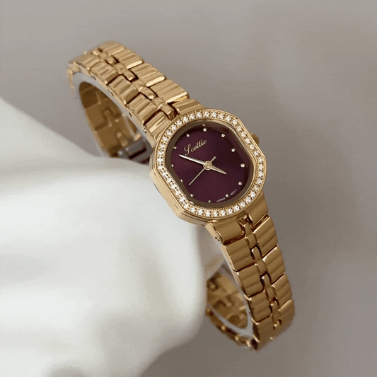 Feminine Luxury: Red Round Dial Watch with Gold Diamond Bezel & Stainless Steel Bracelet