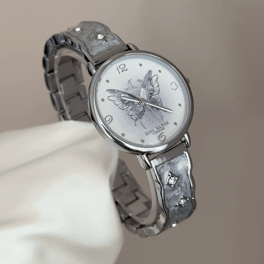 Feminine Charm: White Round Dial Watch with Butterfly Motif & Silver Stainless Steel Bracelet